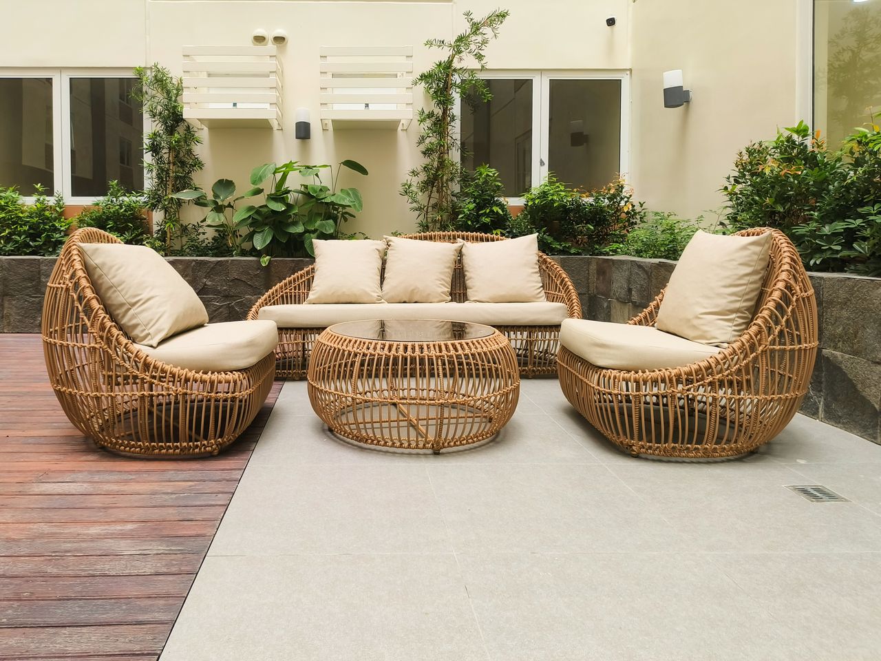 Modern outdoor rattan furniture set on a stylish terrace in Manila, Philippines.